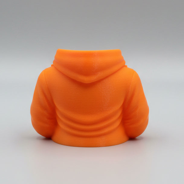An orange 3D-printed bust accessory shaped like a hoodie, shown from the back on a reflective orange surface against a neutral gray background.