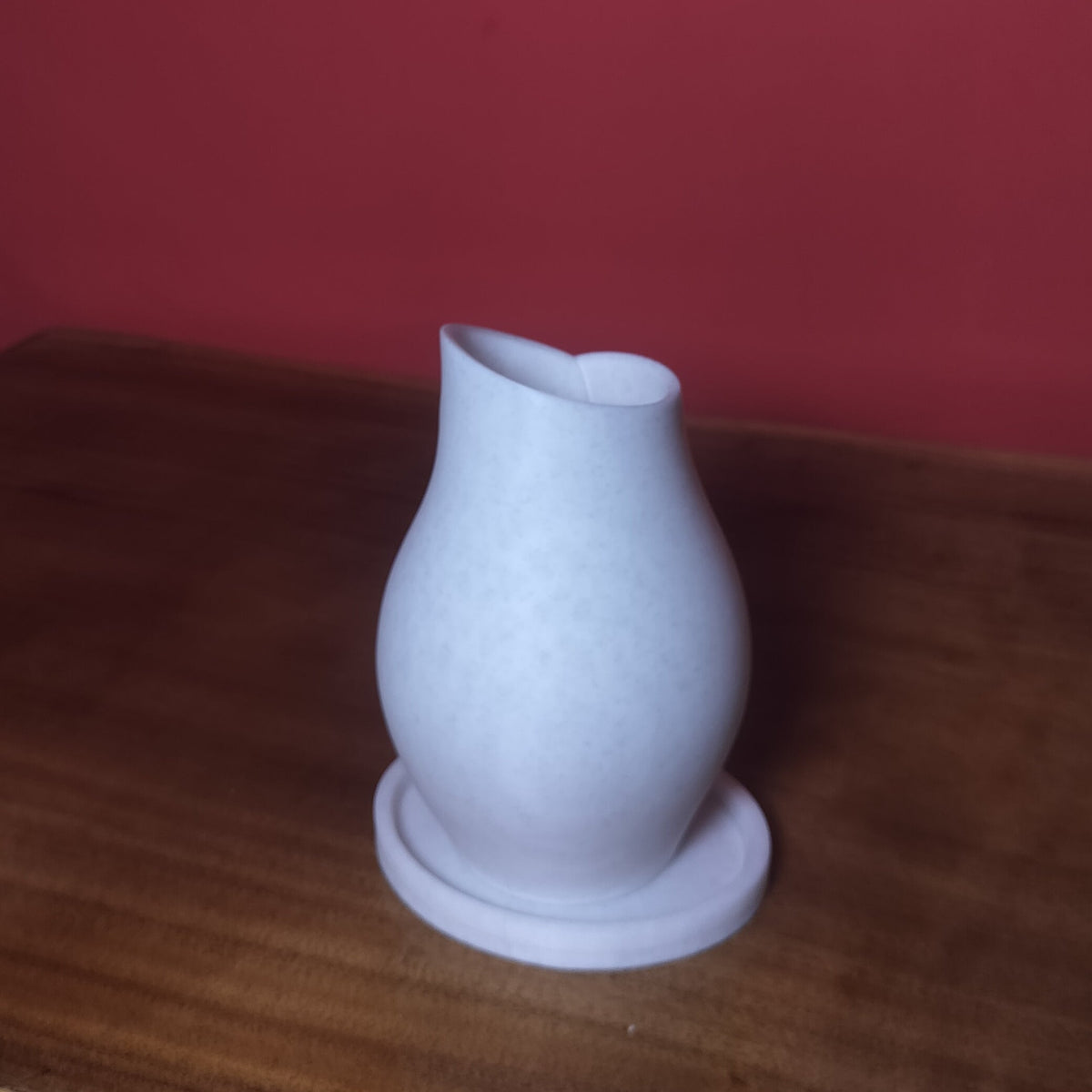 Stylish Curved Vase with Base